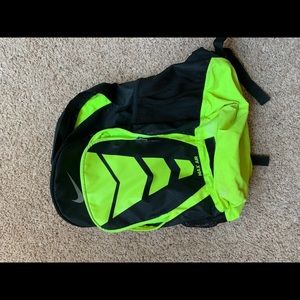 A neon green Nike backpack
